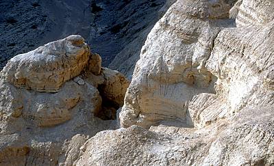 Qumran Cave 8 left and Cave 7 right